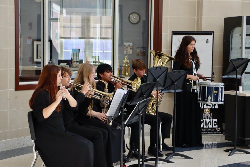 Members of the Cape Henlopen High School band perform in the high school lobby.